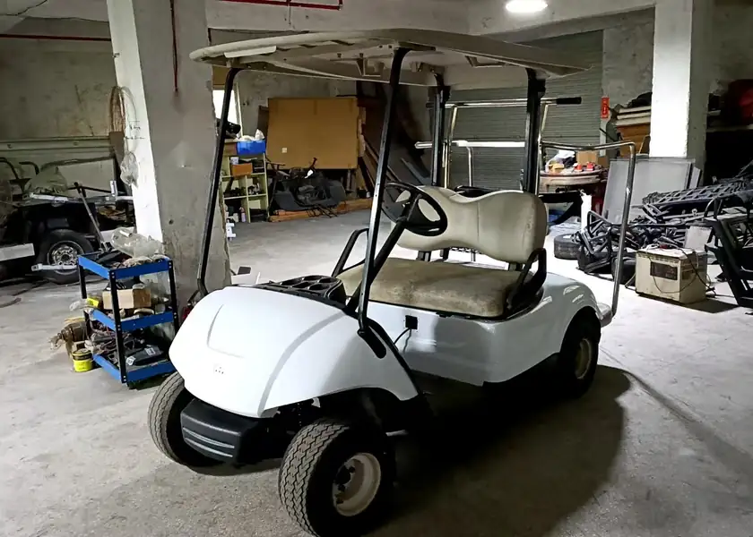 Yamaha Drive golf cart in a repair shop
